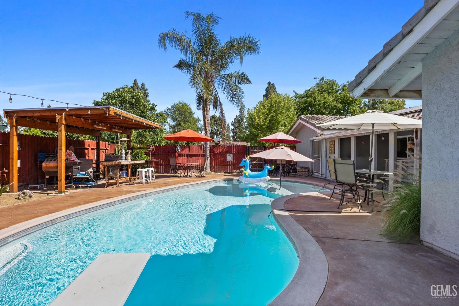 a view of a patio with chairs and a patio