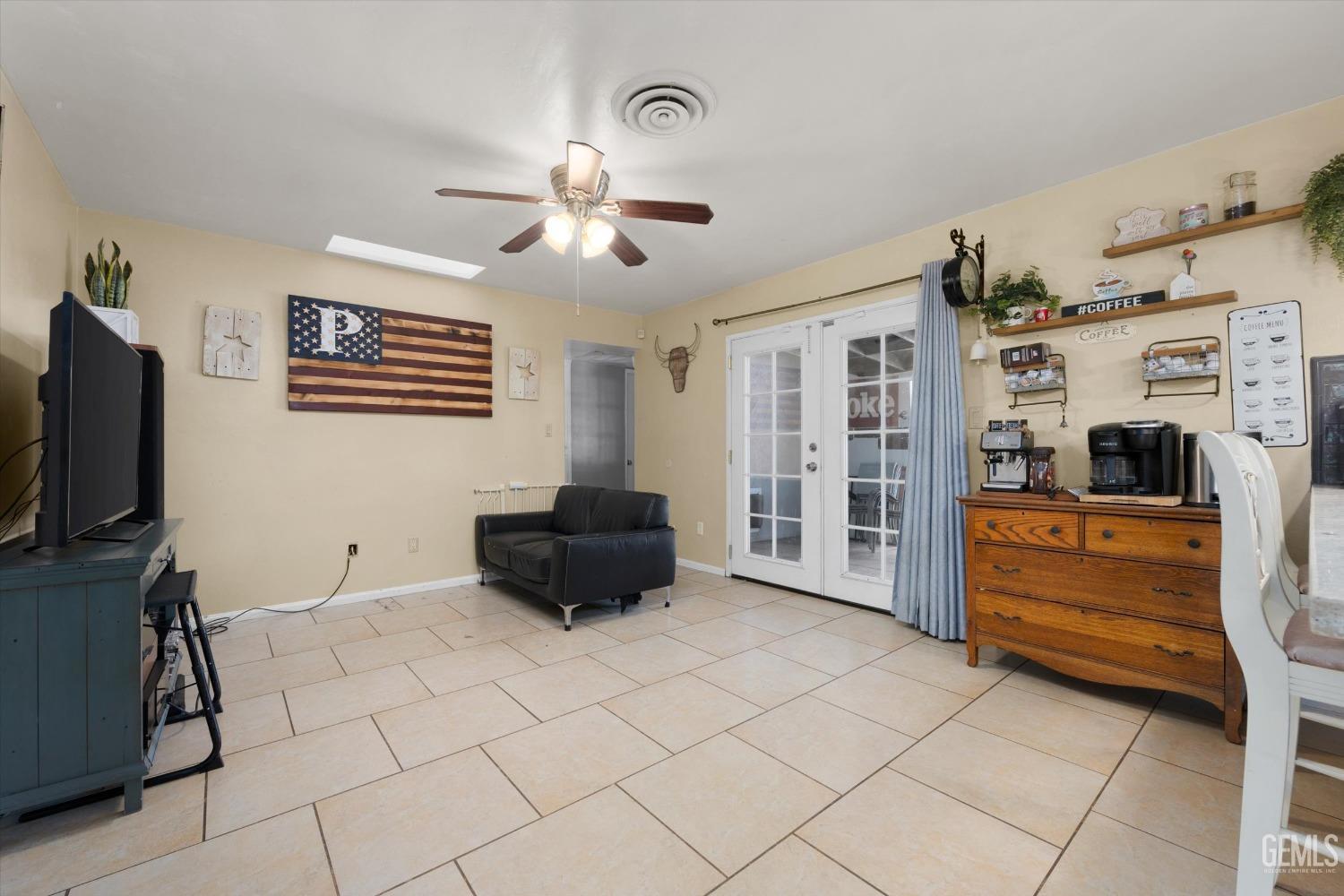 Undisclosed Address Bakersfield, CA 93309 - Photo 14 of 33 a living room with furniture and flat screen tv