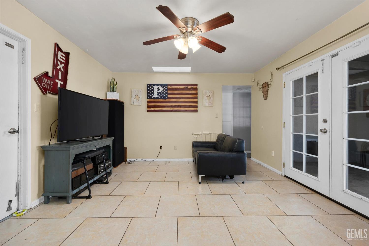 Undisclosed Address Bakersfield, CA 93309 - Photo 15 of 33 a living room with furniture and a flat screen tv