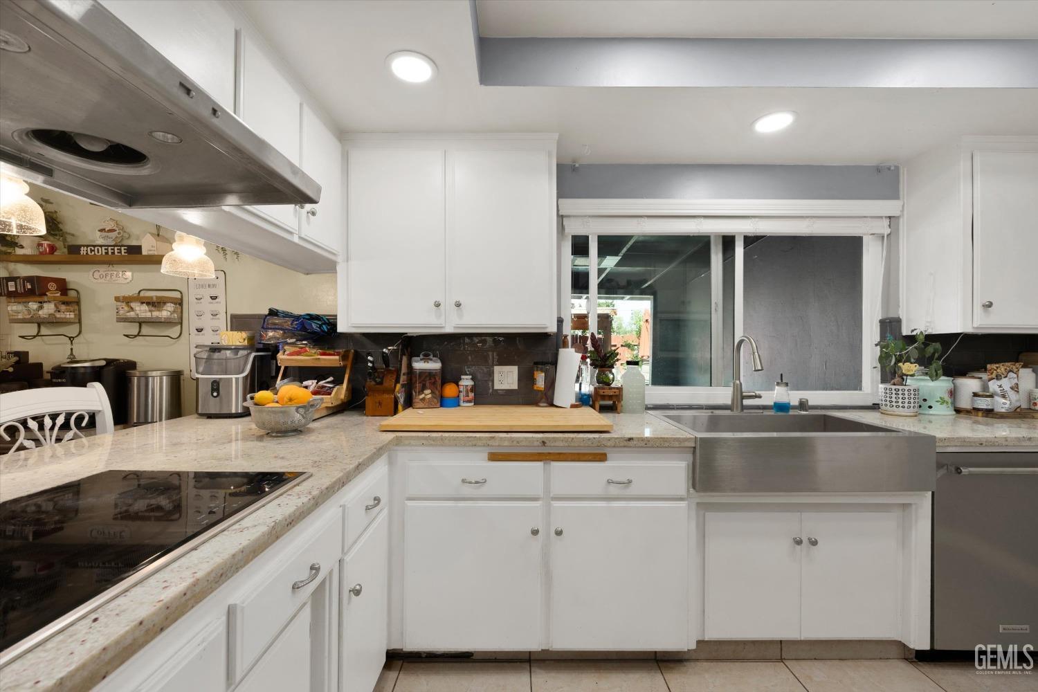 Undisclosed Address Bakersfield, CA 93309 - Photo 19 of 33 a kitchen with stainless steel appliances granite countertop a sink and cabinets