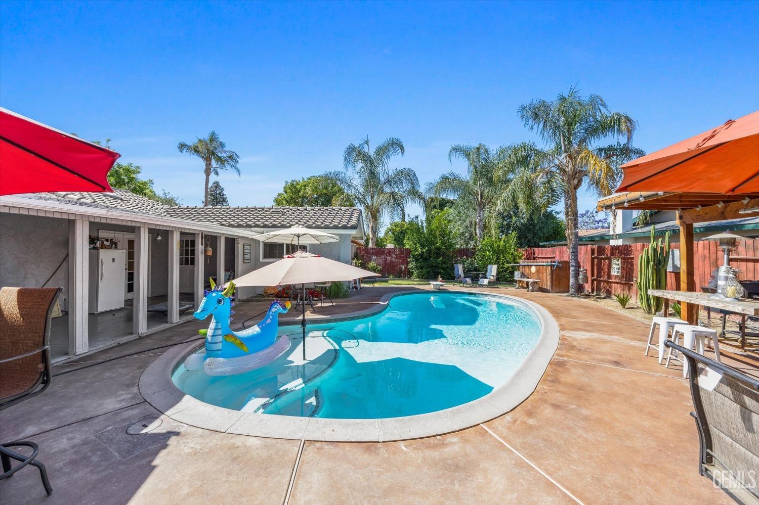 Undisclosed Address Bakersfield, CA 93309 - Photo 30 of 33 a view of a swimming pool with an outdoor seating
