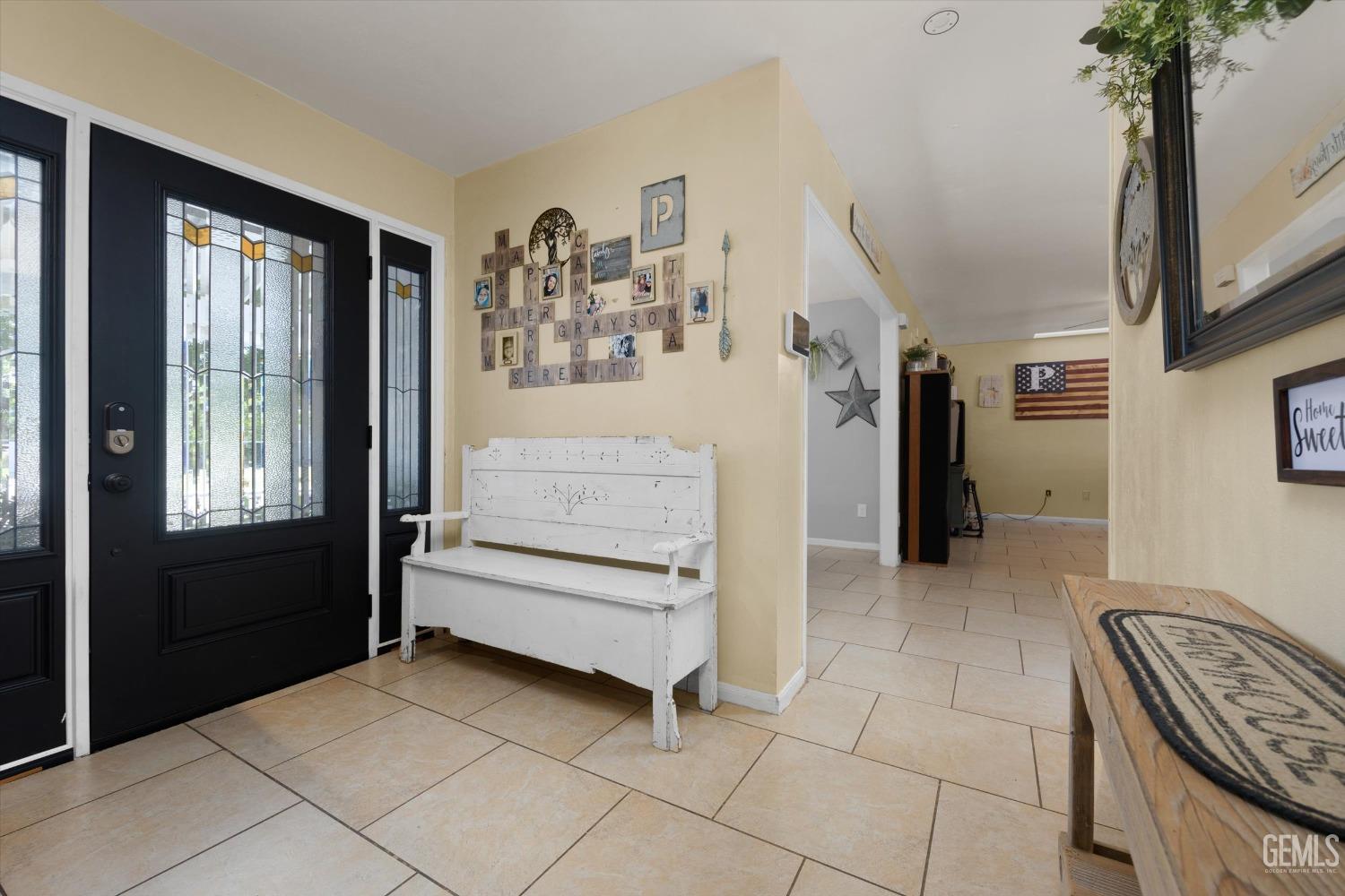 Undisclosed Address Bakersfield, CA 93309 - Photo 5 of 33 a view of hallway with furniture and a window