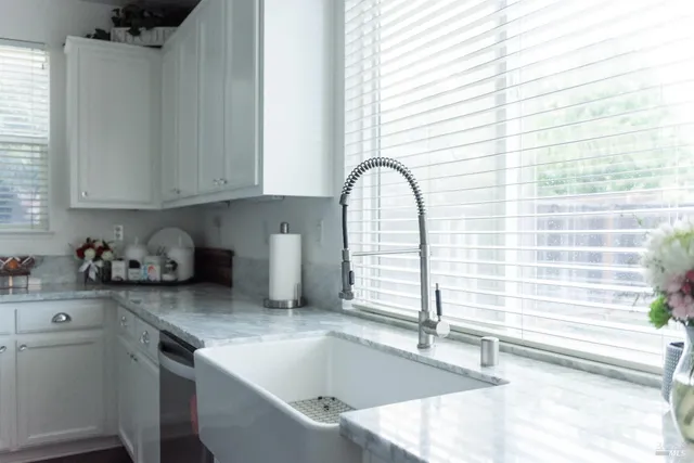 a kitchen with a sink and a window