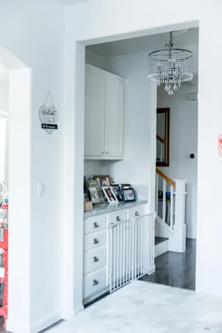 a bathroom with a sink and mirror with toilet