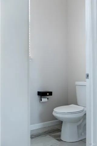 a bathroom with double sink and a mirror