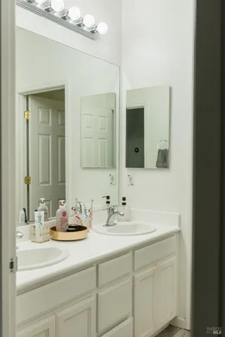 a bathroom with a shower and a sink