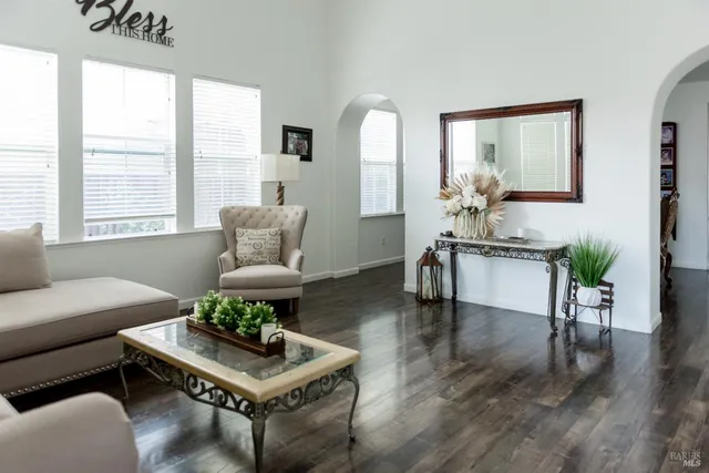 a living room with furniture and a large window
