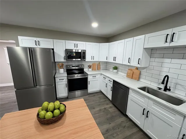 a bathroom with a toilet a sink and a mirror
