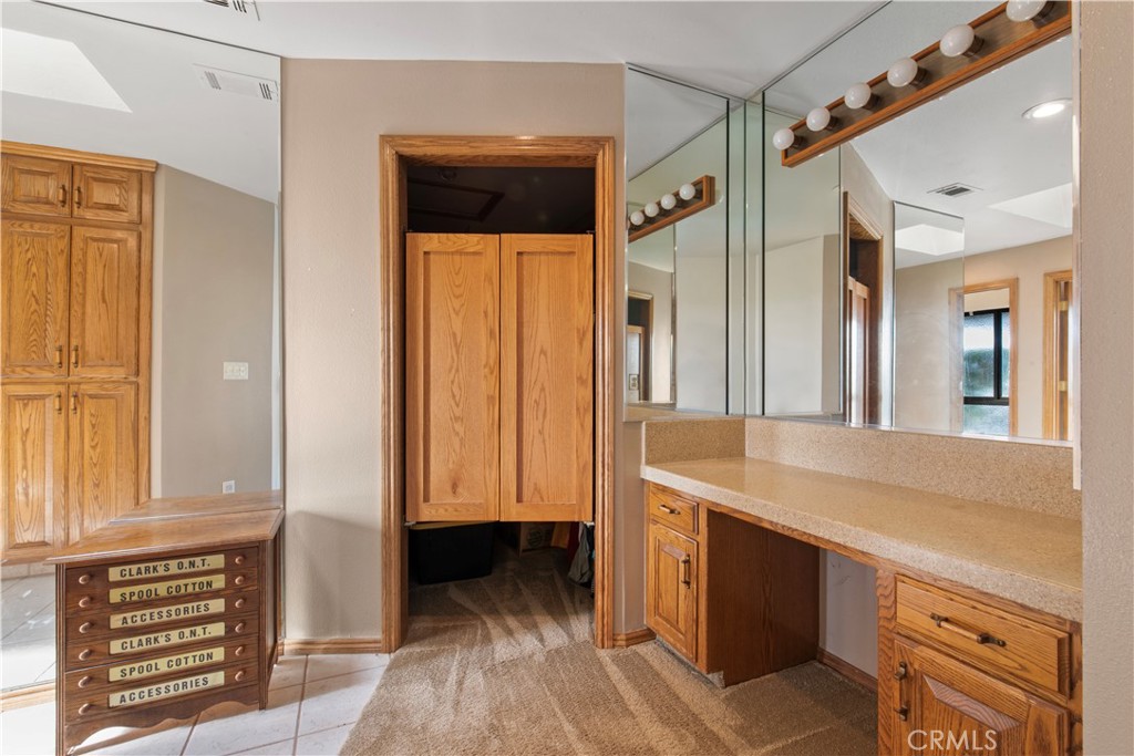 6922 G Street Merced, CA 95340 - Photo 25 of 39 a bathroom with a sink and a mirror