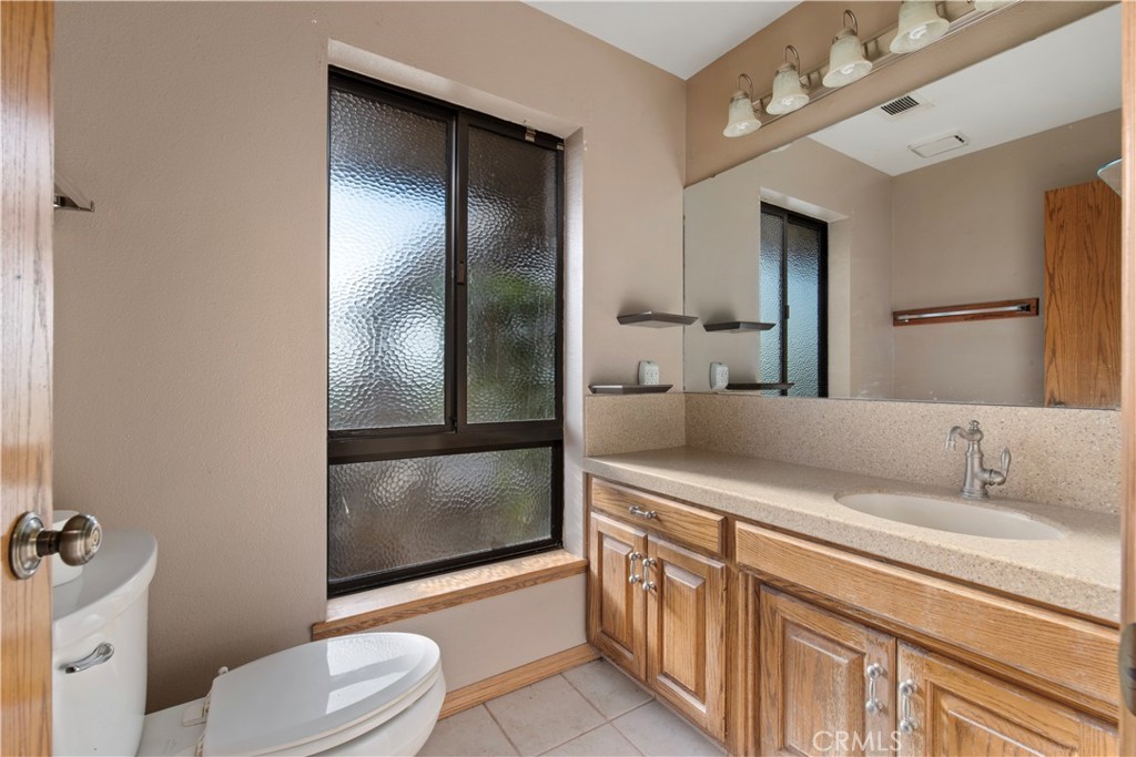 6922 G Street Merced, CA 95340 - Photo 27 of 39 a bathroom with a sink a toilet and shower