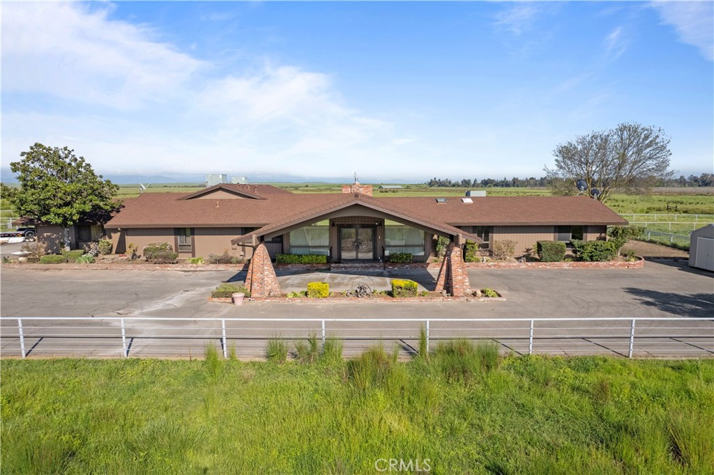 6922 G Street Merced, CA 95340 - Photo 29 of 39 a view of a house with a big yard and large trees