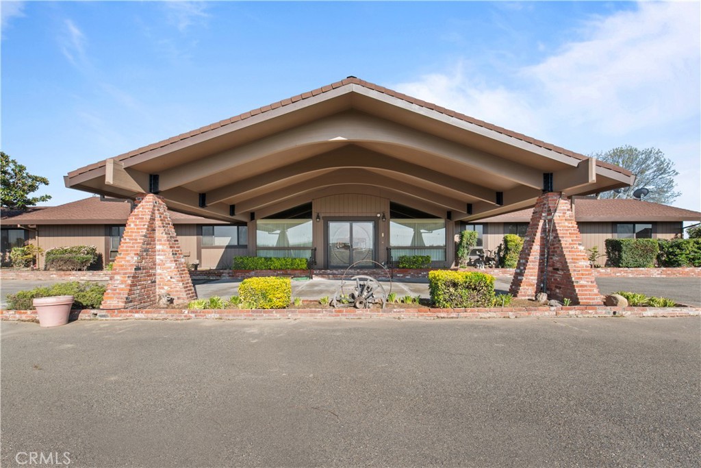 6922 G Street Merced, CA 95340 - Photo 3 of 39 a view of an chairs under an umbrella