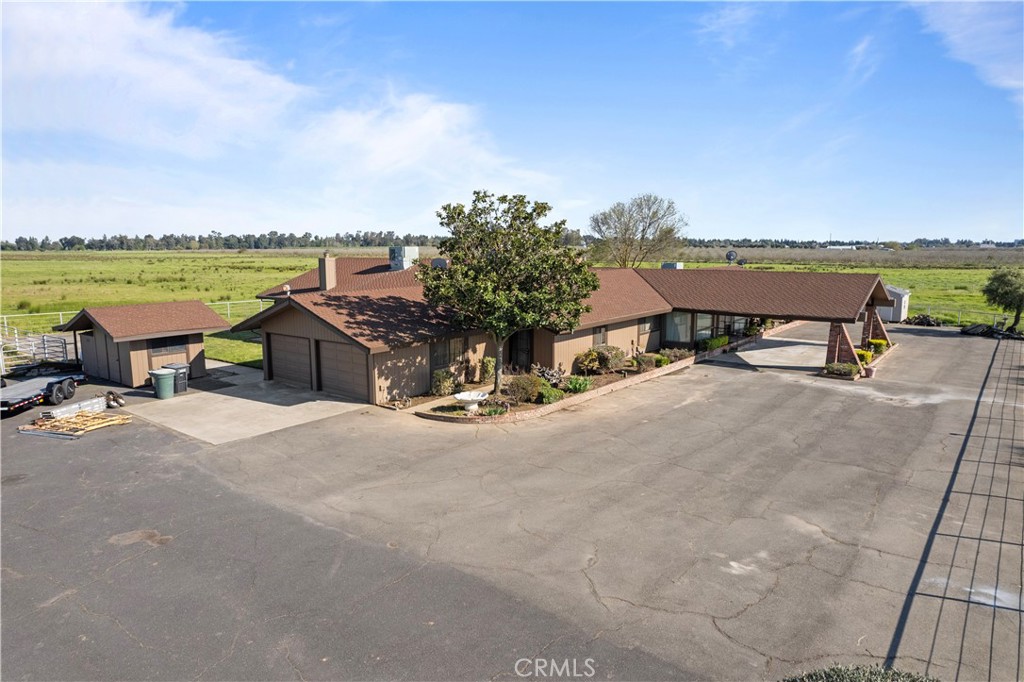 6922 G Street Merced, CA 95340 - Photo 35 of 39 a view of a terrace with a table and chairs under an umbrella