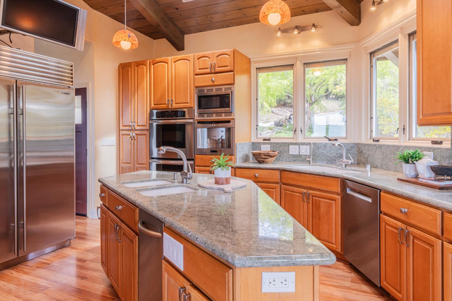 430 Quail Run Road Aptos, CA 95003 - Photo 24 of 34 a kitchen with stainless steel appliances granite countertop a sink and a large window