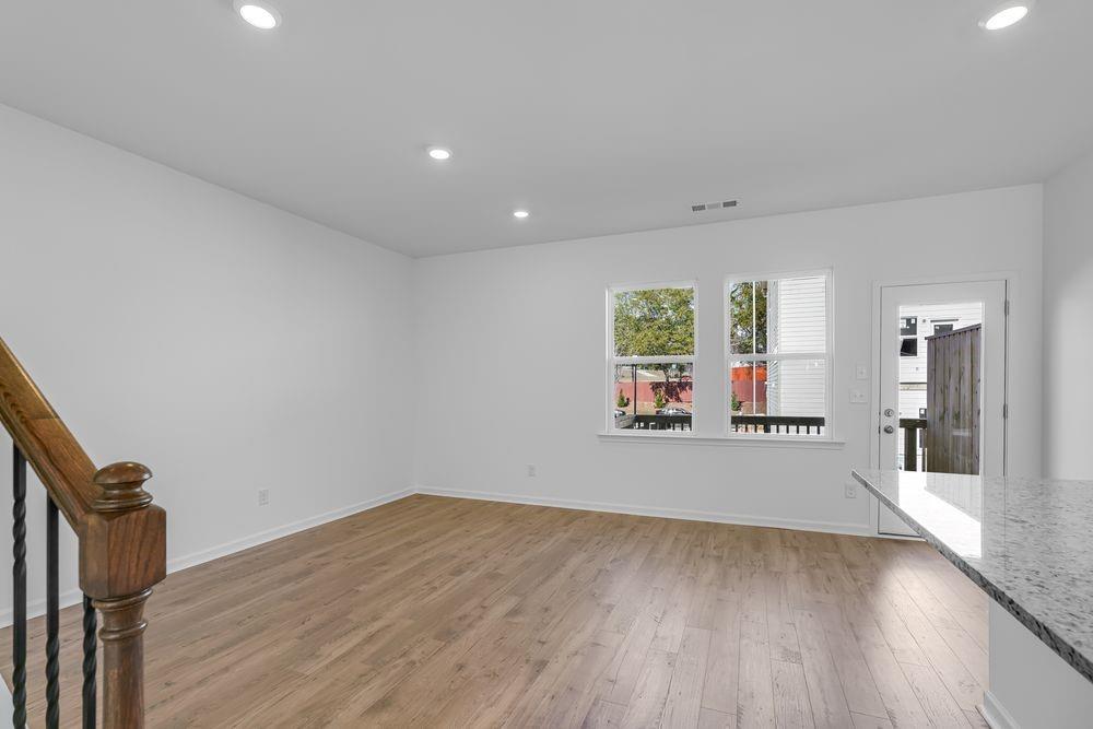 6117 Wayburn Street Tucker, GA 30084 - Photo 14 of 48 wooden floor in an empty room with a window