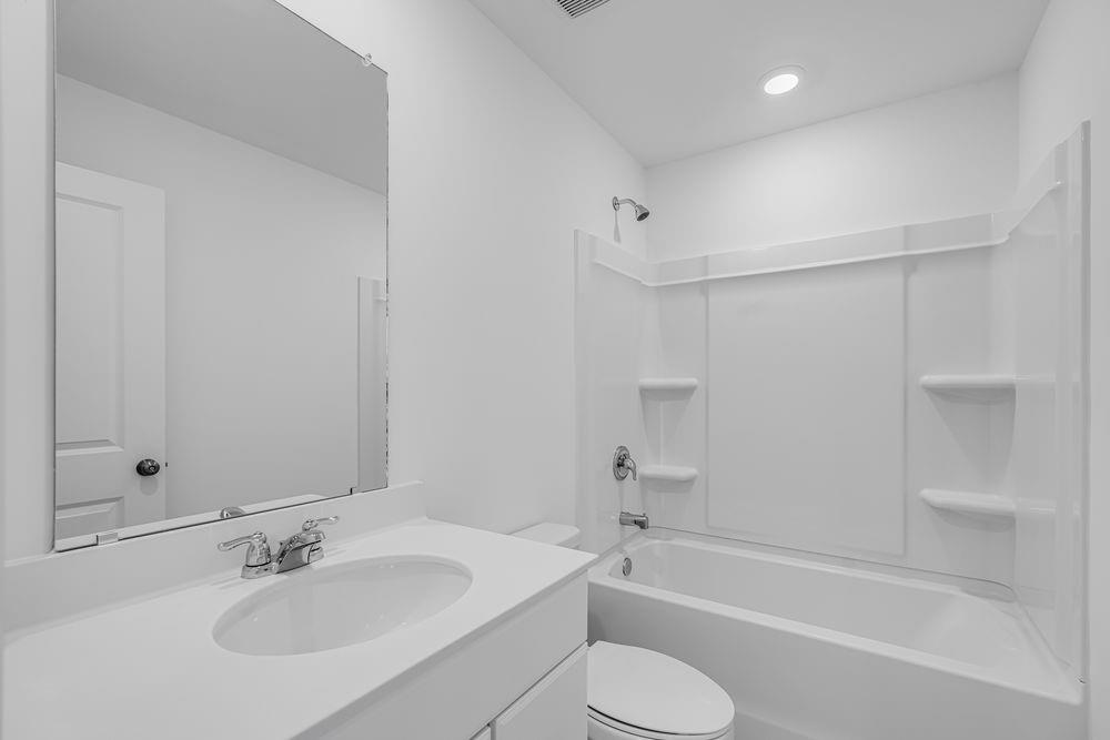 6117 Wayburn Street Tucker, GA 30084 - Photo 30 of 48 a bathroom with a sink toilet and bathtub