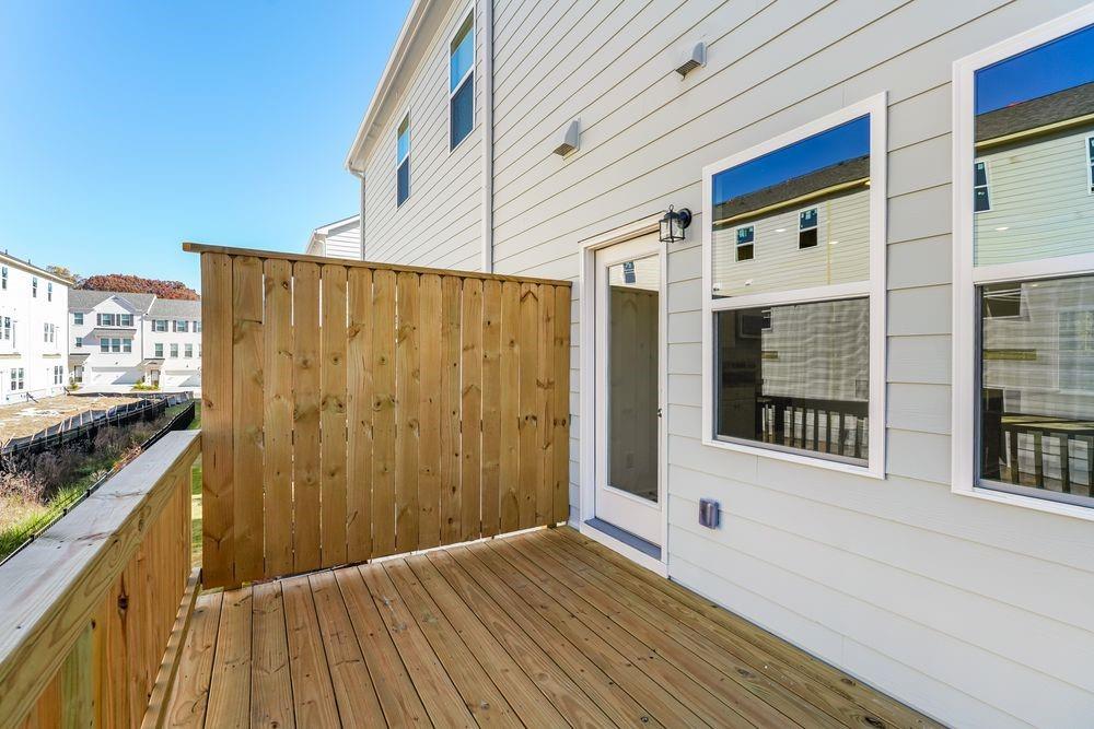 6117 Wayburn Street Tucker, GA 30084 - Photo 32 of 48 a view of a balcony with wooden floor and fence