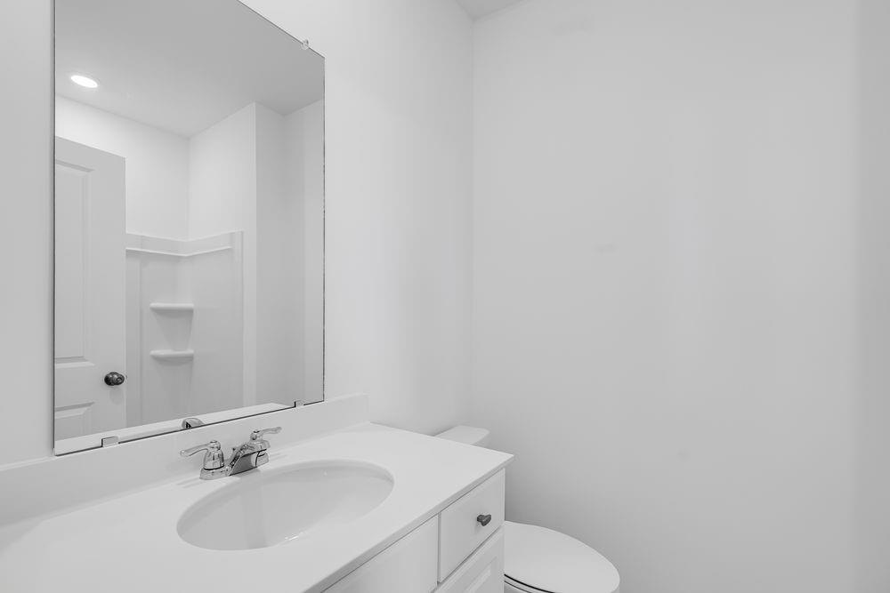 6117 Wayburn Street Tucker, GA 30084 - Photo 5 of 48 a bathroom with a sink toilet and vanity