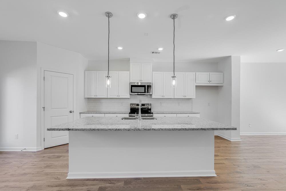 6117 Wayburn Street Tucker, GA 30084 - Photo 6 of 48 a view of a kitchen with stainless steel appliances granite countertop cabinets