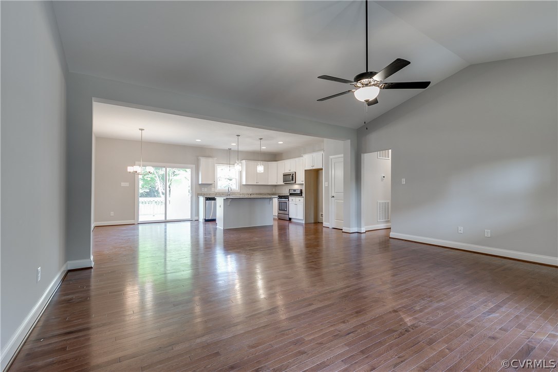 3762 Boundary Run Road Gum Spring, VA 23065 - Photo 3 of 25 a view of an empty room with wooden floor and a ceiling fan