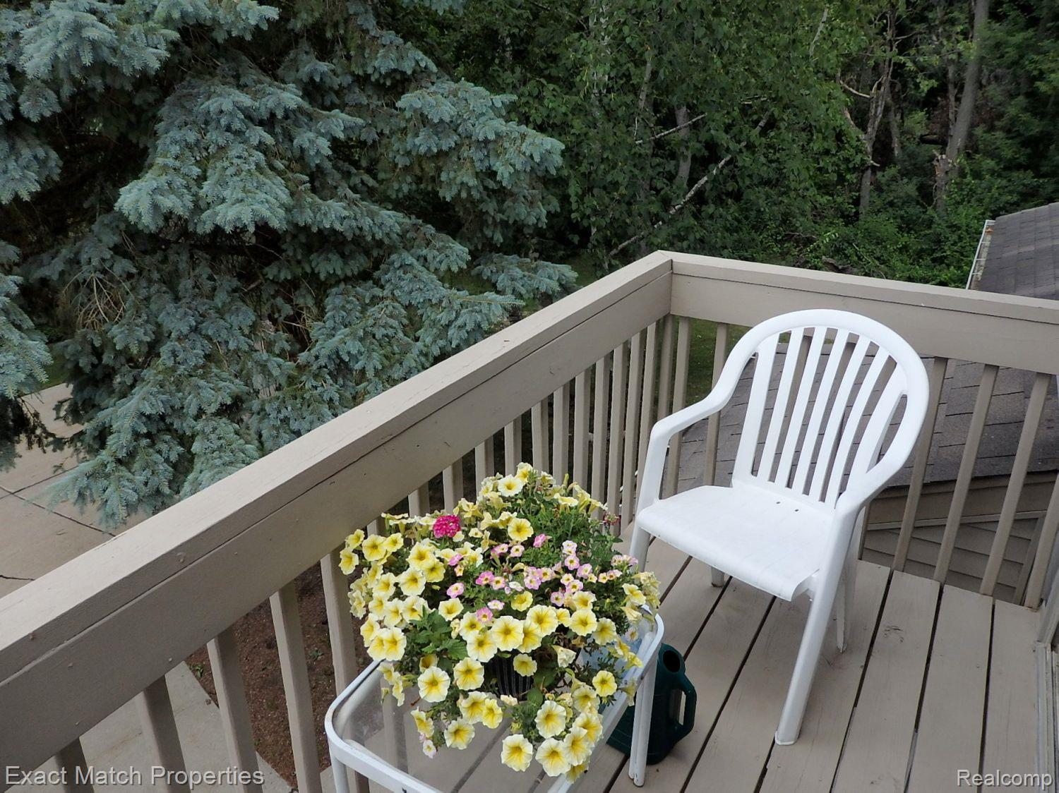 240 Pine Tree Ridge, Unit 4 Waterford, MI 48327 - Photo 16 of 37 Balcony overlooks the wooded common area.