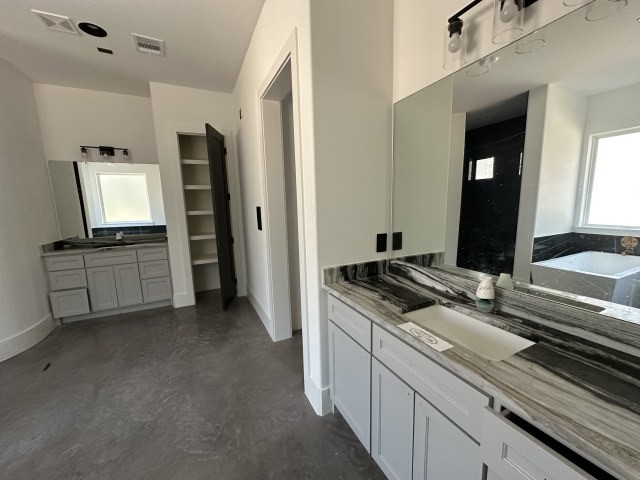 875 Lonestar Road Huntsville, TX 77340 - Photo 15 of 24 a kitchen with cabinets and appliances