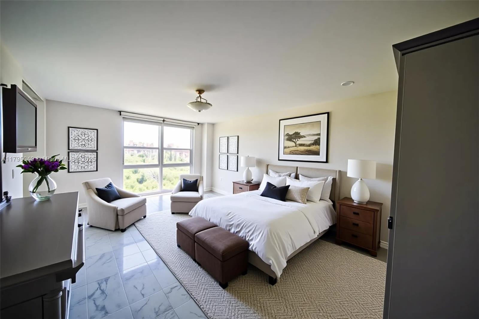 445 Grand Bay Drive, Unit 802 Key Biscayne, FL 33149 - Photo 12 of 24 a bedroom with a bed couch and windows