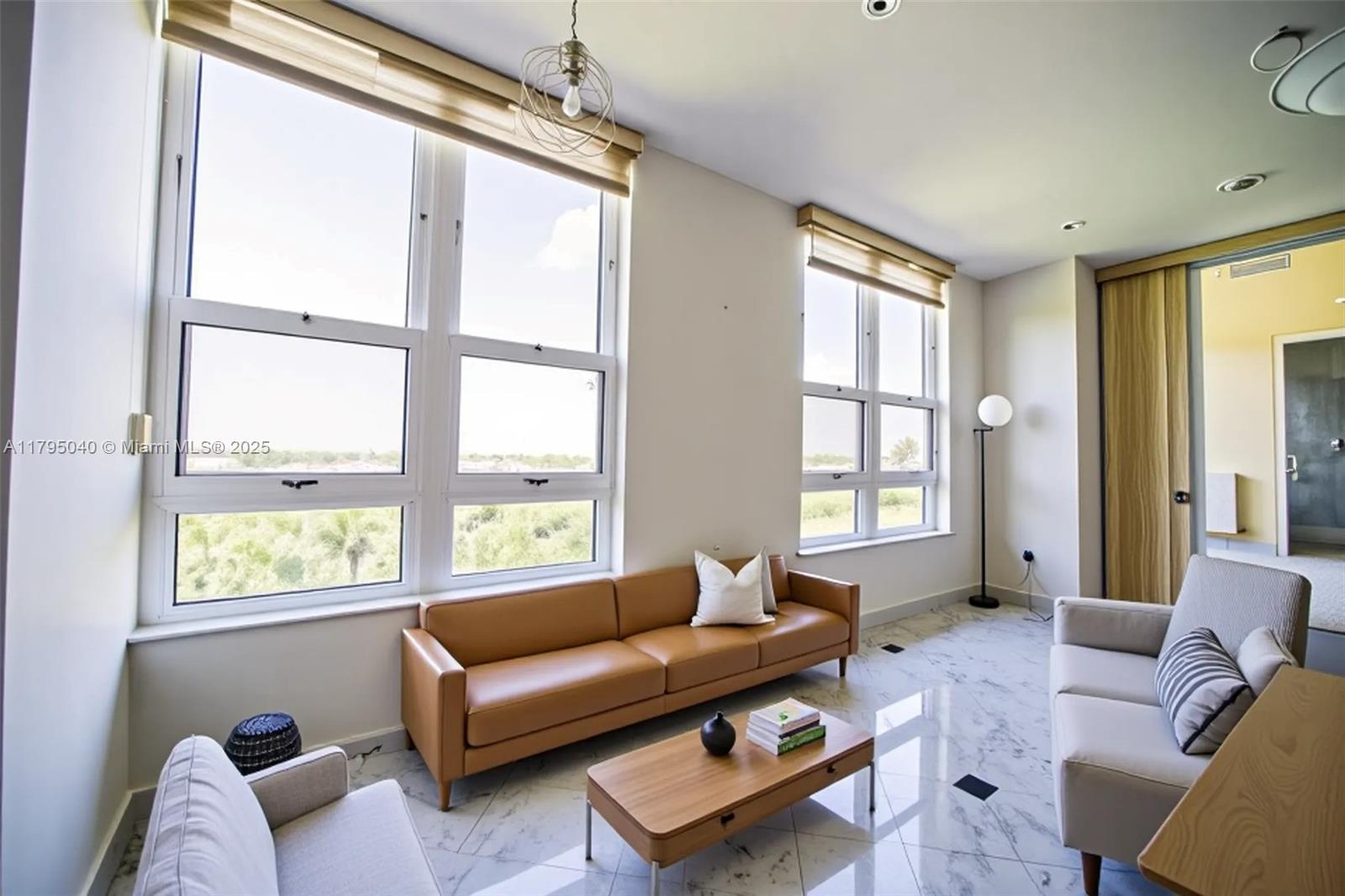 445 Grand Bay Drive, Unit 802 Key Biscayne, FL 33149 - Photo 18 of 24 a living room with furniture and a window