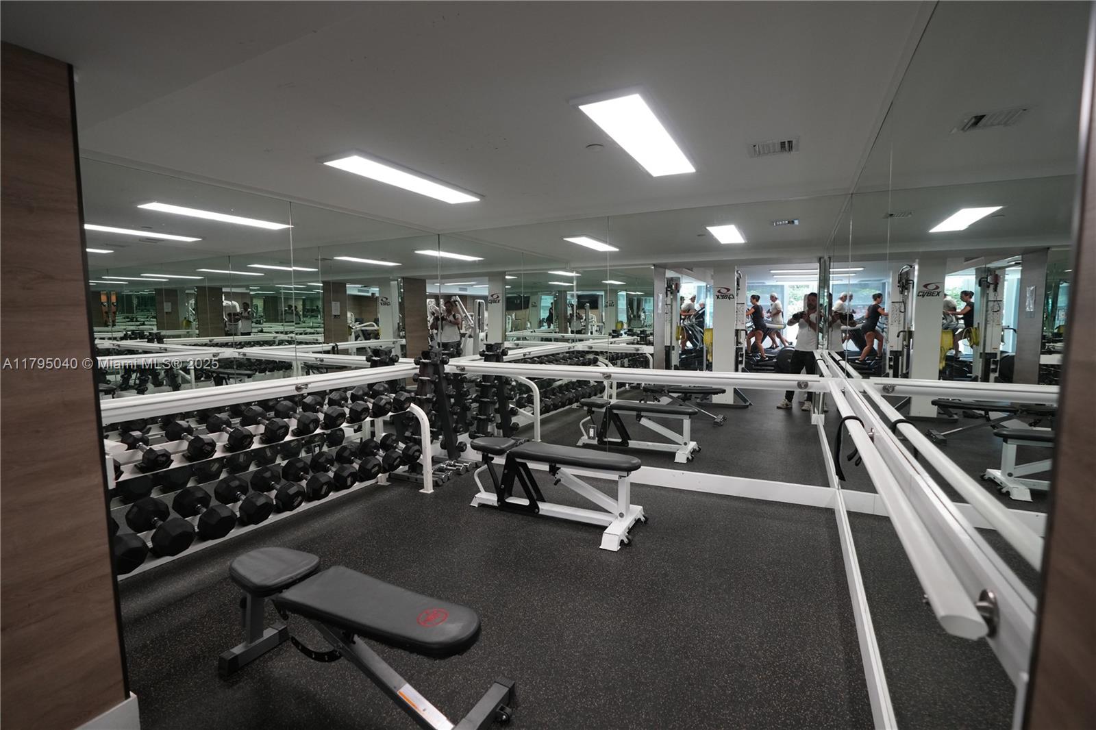 445 Grand Bay Drive, Unit 802 Key Biscayne, FL 33149 - Photo 21 of 24 a view of a room with gym equipment