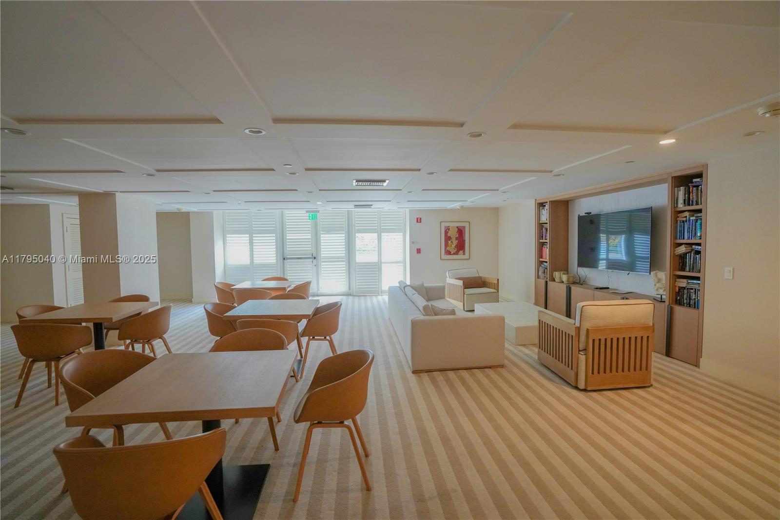 445 Grand Bay Drive, Unit 802 Key Biscayne, FL 33149 - Photo 23 of 24 a living room with fireplace furniture and a wooden floor