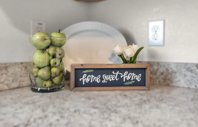 a bathroom with a sink a mirror and a shower