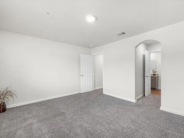 an empty room with a bathroom