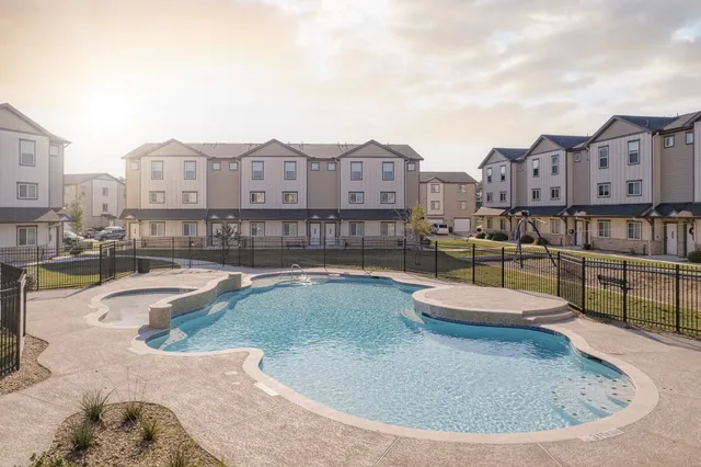 a view of a swimming pool with a lounge chairs
