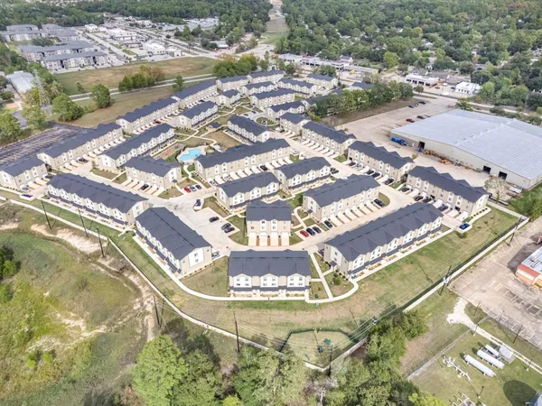 an aerial view of a swimming pool and outdoor space