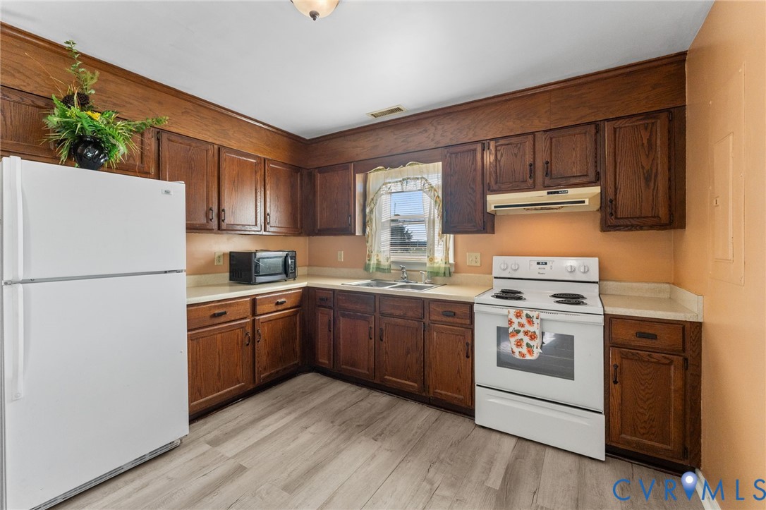 1591 Mt Landing Road Tappahannock, VA 22560 - Photo 8 of 19 Attractive wood cabinets and good counterspace.