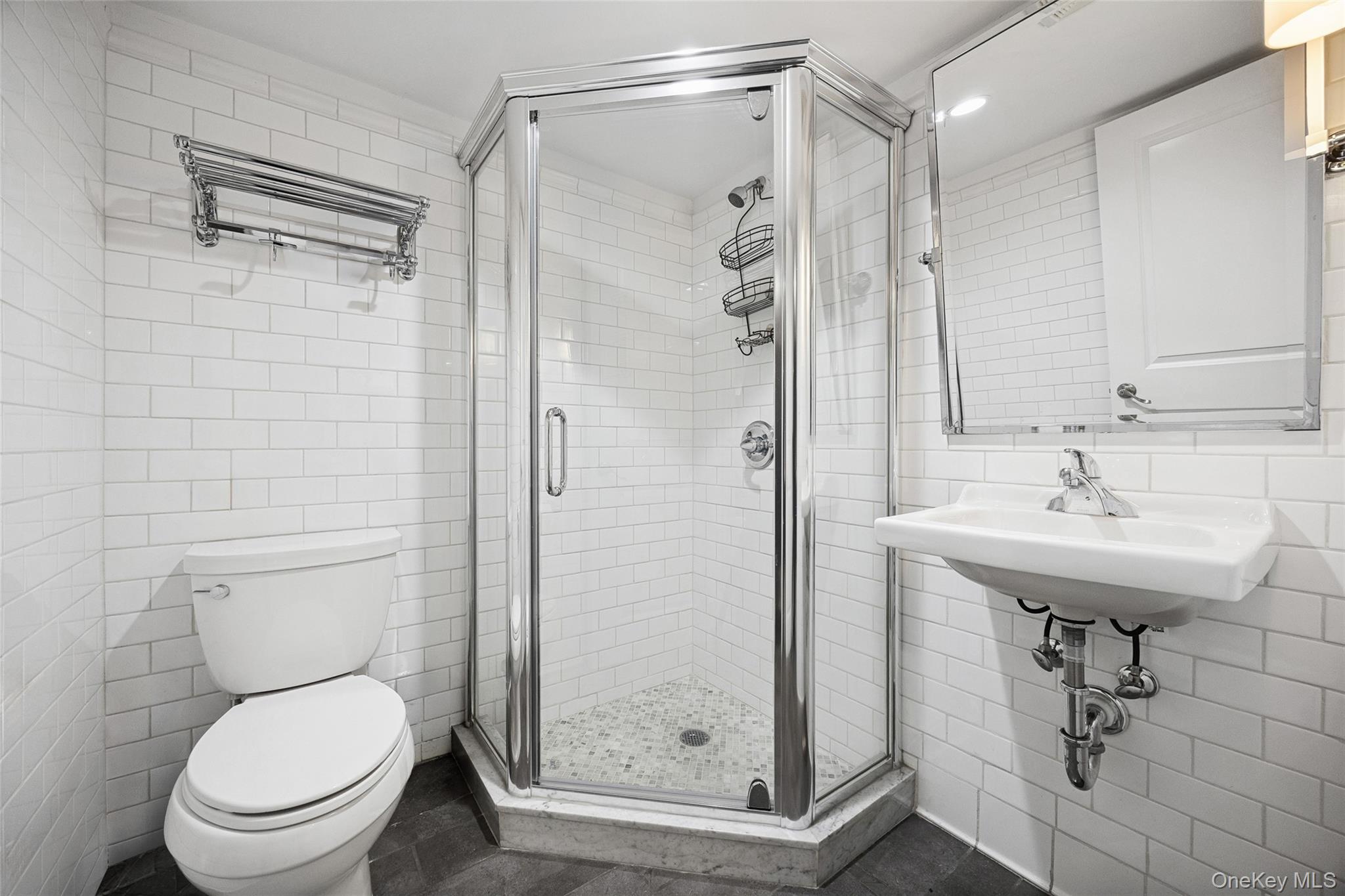 216 Beverly Road Queens, NY 11363 - Photo 41 of 50 a bathroom with a shower toilet and sink