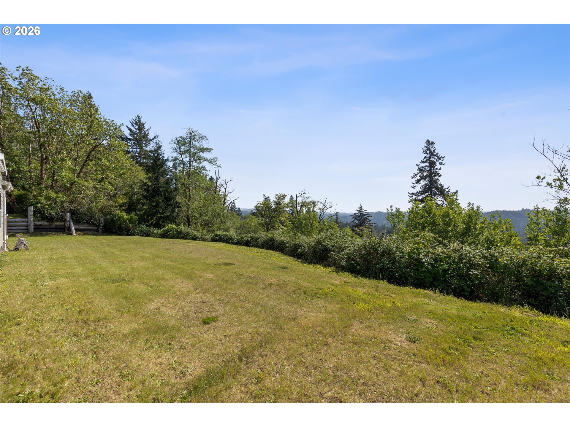 1206 Criteser Loop Toledo, OR 97391 - Photo 32 of 46 a backyard of a house with lots of green space