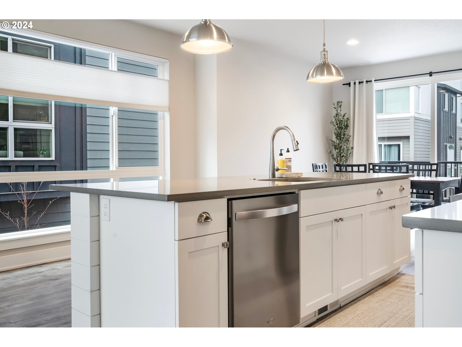 17136 Southwest Woodpecker Lane Beaverton, OR 97007 - Photo 13 of 34 a kitchen with a sink and cabinets
