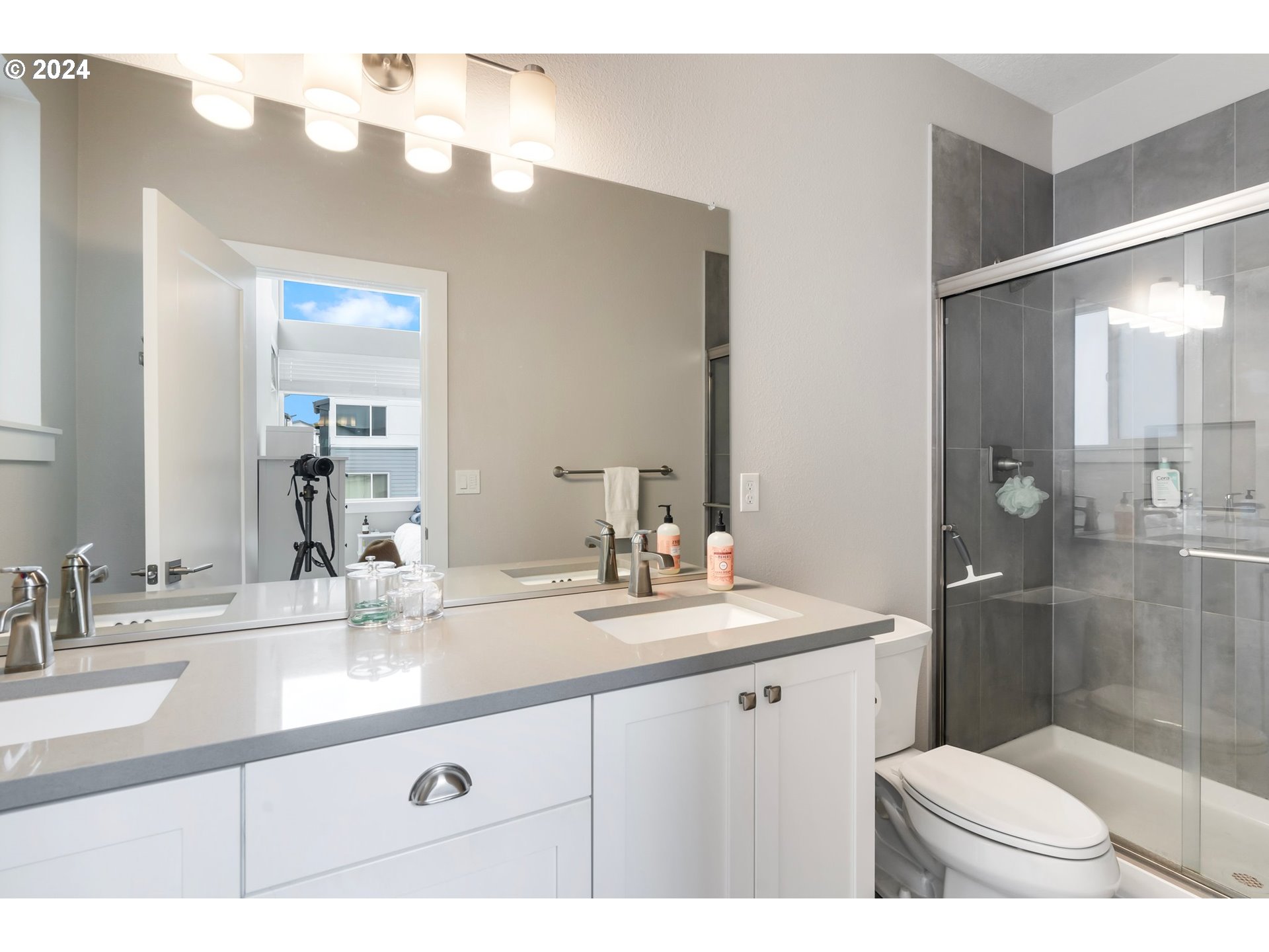 17136 Southwest Woodpecker Lane Beaverton, OR 97007 - Photo 25 of 34 a bathroom with a sink a toilet and shower