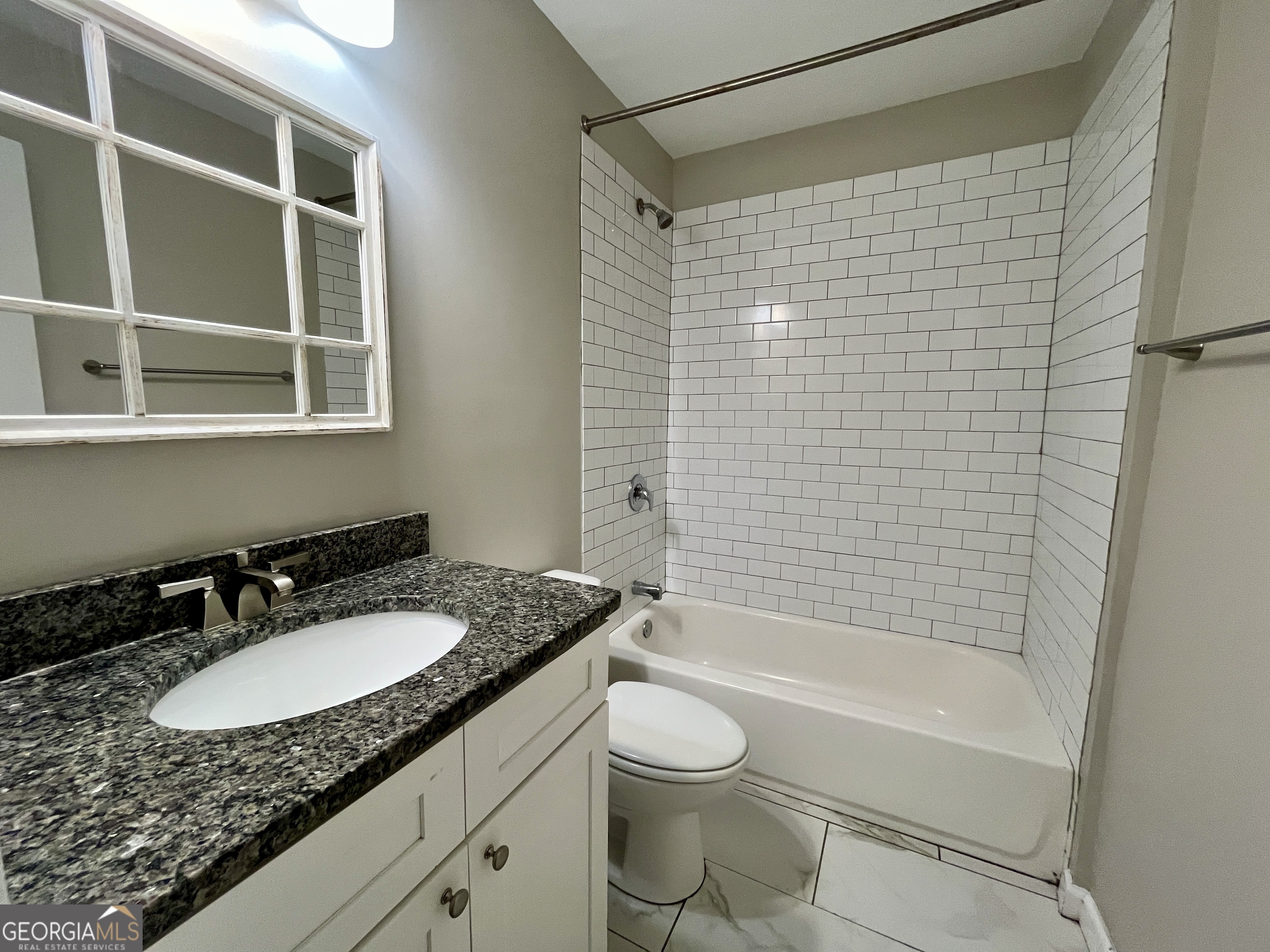 3241 Turner Street, Unit 30 East Point, GA 30344 - Photo 10 of 12 a bathroom with a granite countertop sink toilet and shower