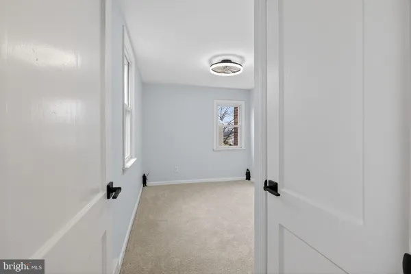 a bathroom with a toilet and a tub