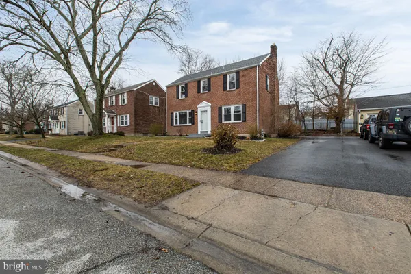 a view of a big house with a street