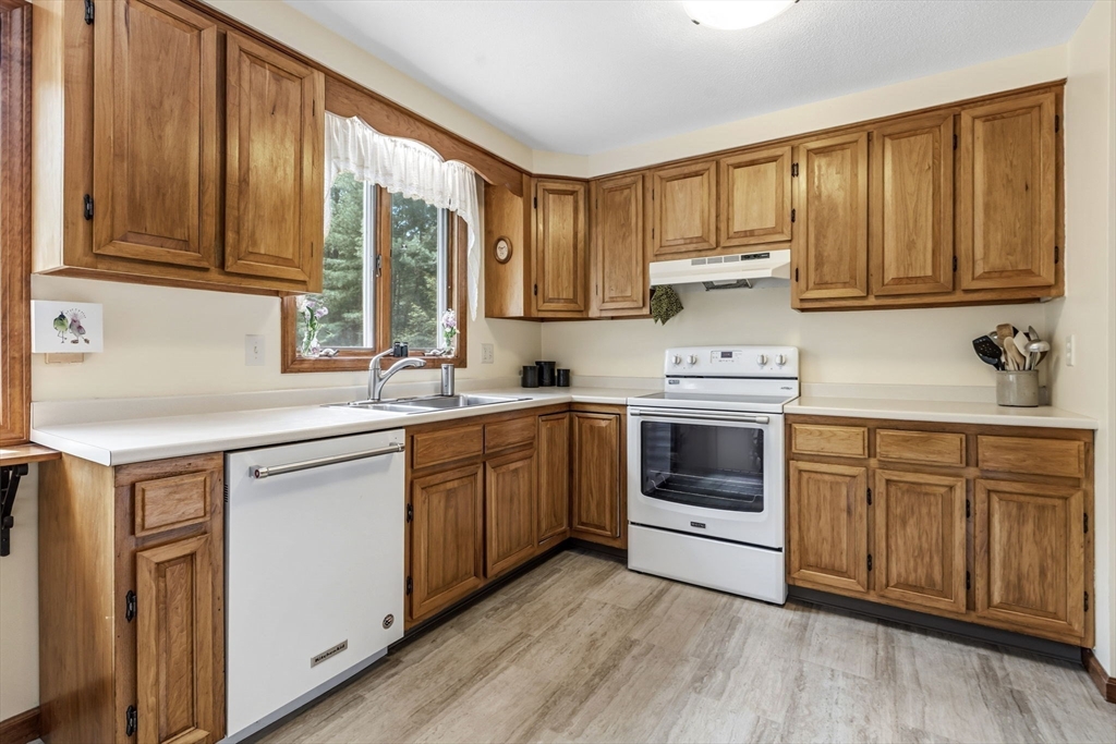788 Burts Pit Road Northampton, MA 01062 - Photo 9 of 42 a kitchen with stainless steel appliances granite countertop a stove a sink dishwasher and a refrigerator