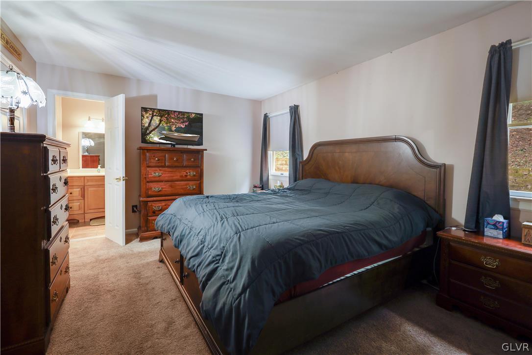 4585 Maple Drive Walnutport, PA 18088 - Photo 11 of 36 a spacious bedroom with a bed and a walk in closet