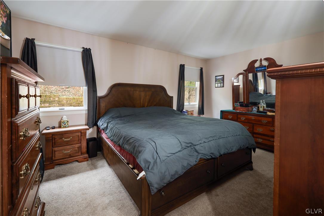 4585 Maple Drive Walnutport, PA 18088 - Photo 12 of 36 a spacious bedroom with a bed and large windows