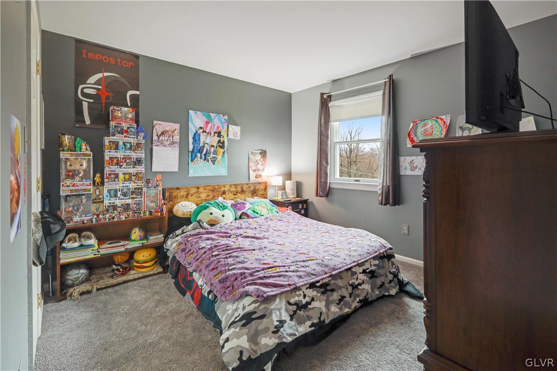 4585 Maple Drive Walnutport, PA 18088 - Photo 13 of 36 a bedroom with a bed and dresser