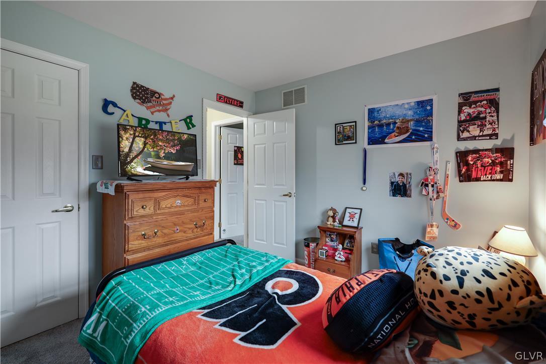 4585 Maple Drive Walnutport, PA 18088 - Photo 17 of 36 a bedroom with two beds and a dresser