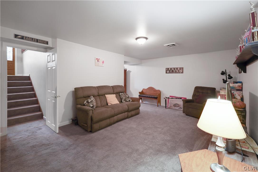 4585 Maple Drive Walnutport, PA 18088 - Photo 19 of 36 a living room with furniture and a lamp