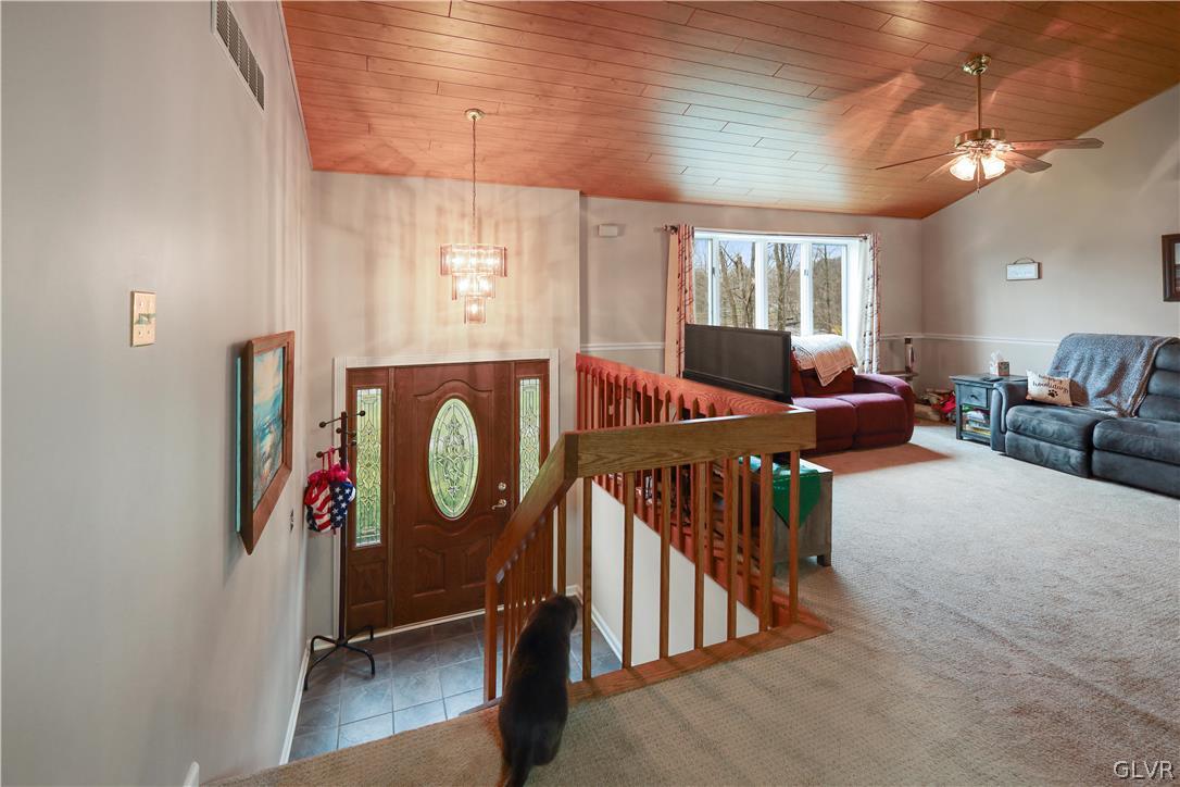 4585 Maple Drive Walnutport, PA 18088 - Photo 2 of 36 a living room with furniture a window and a chandelier