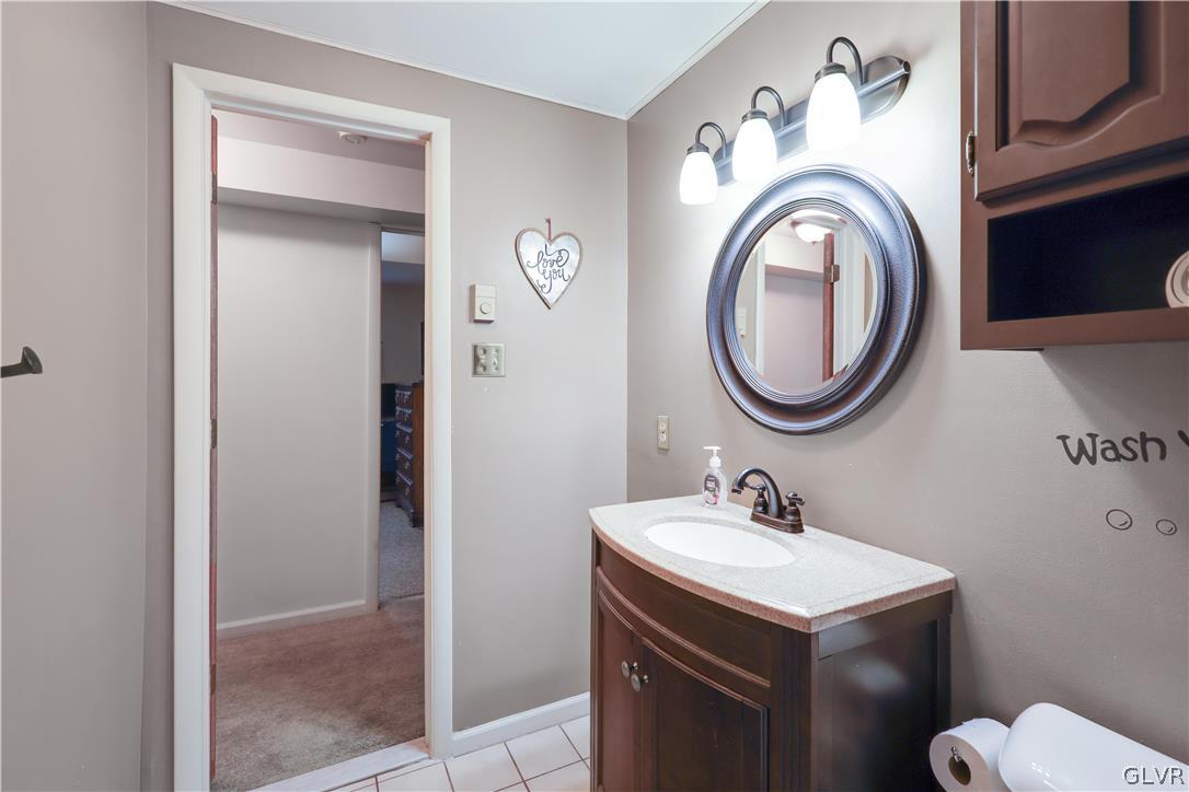 4585 Maple Drive Walnutport, PA 18088 - Photo 24 of 36 a bathroom with a sink mirror and a toilet